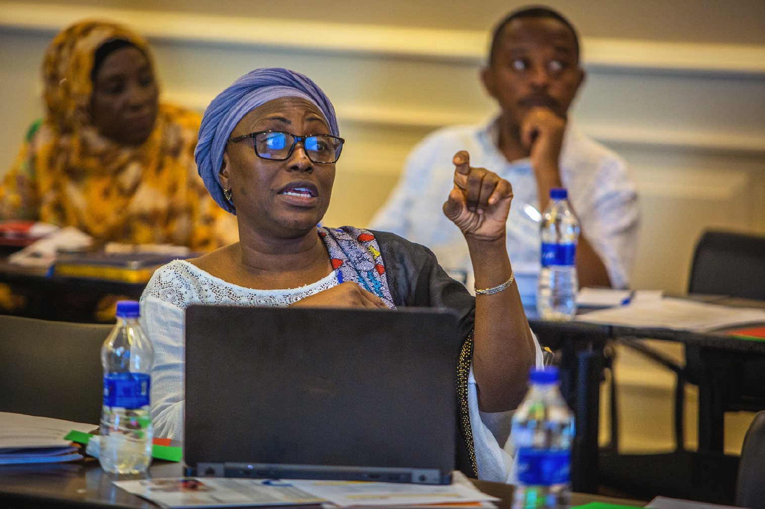Photo of a woman speaking in an event room